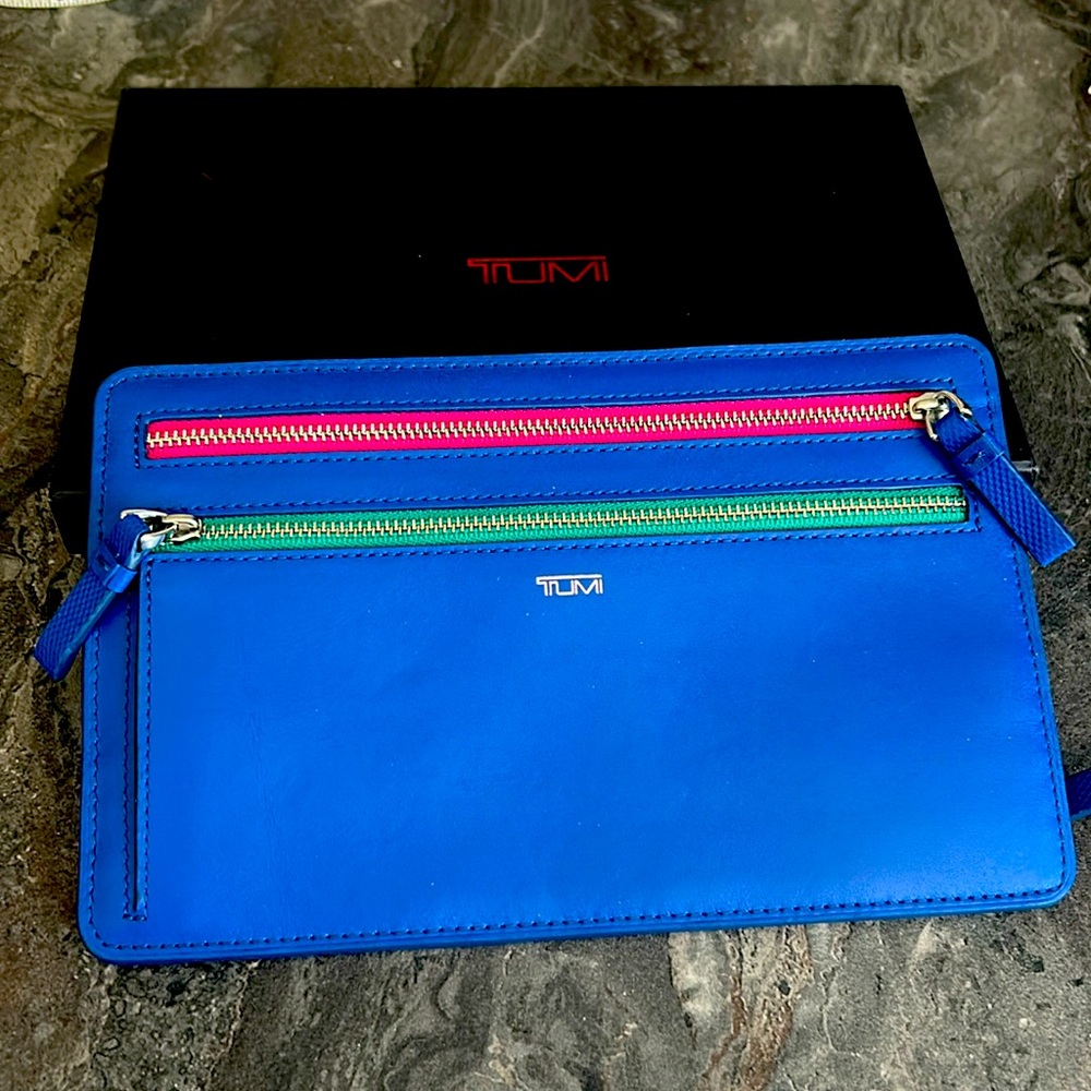 Tumi Clutch with 4 zipper/compartments.